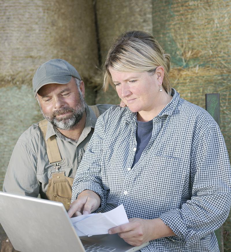 man and woman making plans on the farm