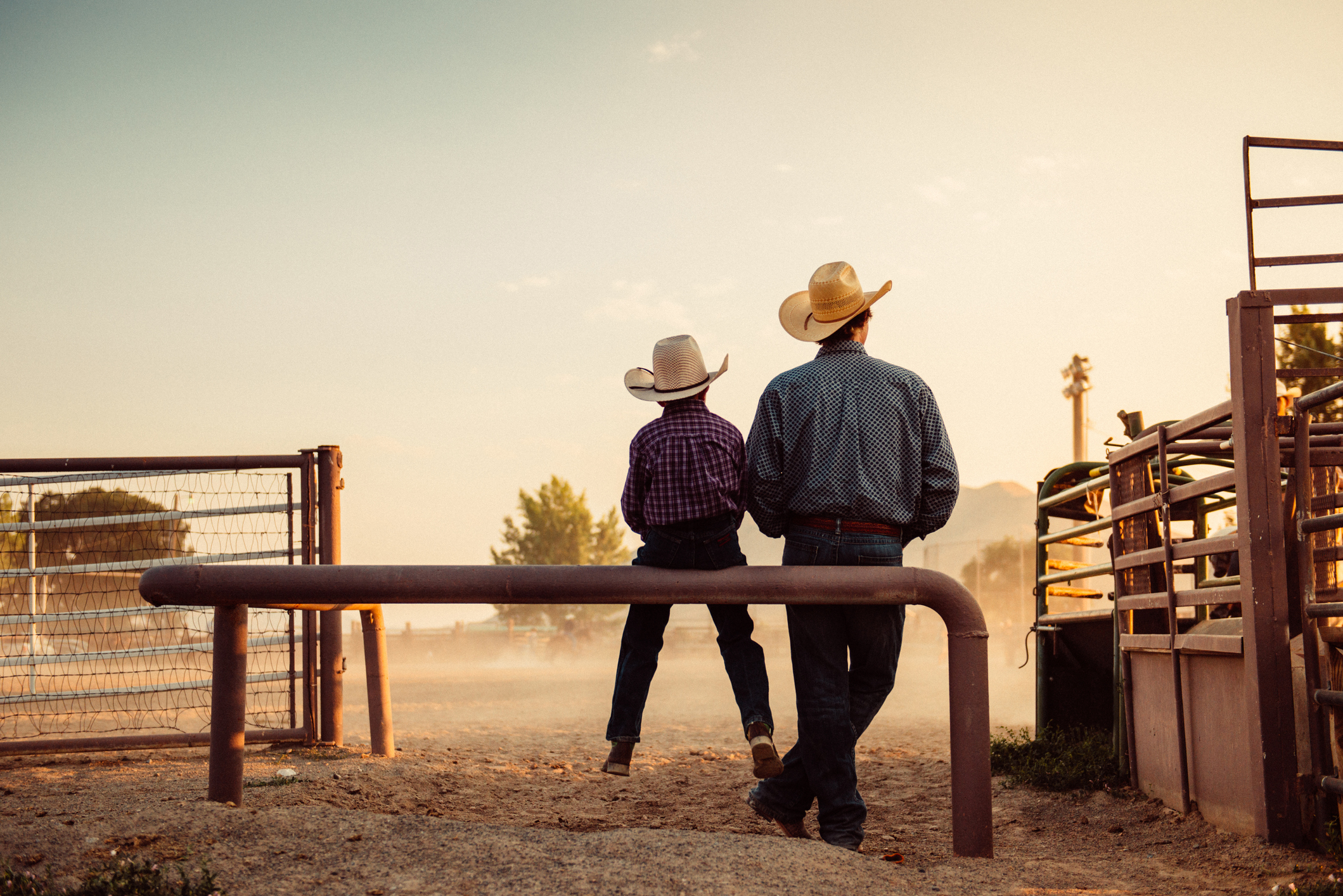 Man and son with cowboy hats